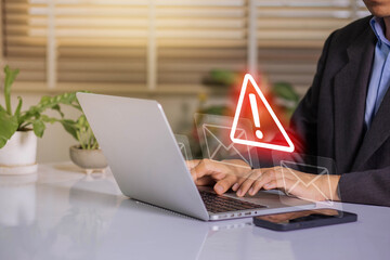 Businessman using laptop with electronic email hacking and spam warning symbol. cyber attack network, virus, spyware, Cyber security and cybercrime. - obrazy, fototapety, plakaty