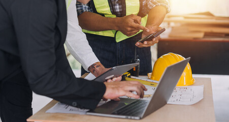 Two business man construction site engineer. Engineering objects on workplace with partners interacting on background