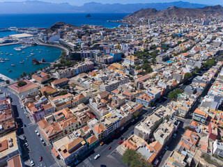 Obraz na płótnie Canvas The city of Mindelo, located on the island of São Vicente in Cabo Verde, is a place of vibrant landscapes. It boasts colorful streets, a bustling port, a lively cultural center with music, dance...