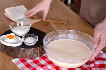 The cook prepares the dough according to the recipe. Ingredients for the dough