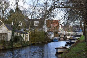 Broek in Waterland, Netherlands. February 2023. The canals and antique wooden houses in Broek in Waterland.