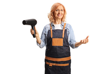 Female hair stylist wearing an apron and holding a hair dryer