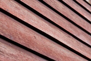 In Selective focus old wooden wall of a house for background backdrop 