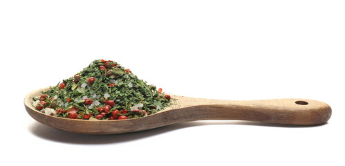 Mixture of sea salt and spices, french style, sea ​​salt, parsley, chives chopped, dill, coriander, tarragon and red peppercorns in wooden spoon, isolated on white