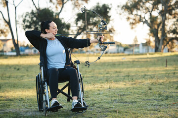 Outdoor archery, disabled woman in wheelchair and challenge for active sports lifestyle in Canada....
