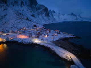 White snow mountain in Lofoten islands, Nordland county, Norway, Europe. Hills and trees, nature landscape in winter season. Winter background.