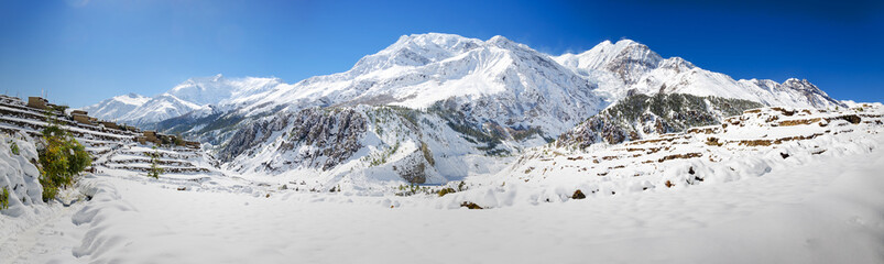 Panorama of the Annapurna massif in the Himalayas. Manang village on the Annapurna Circuit trail.
