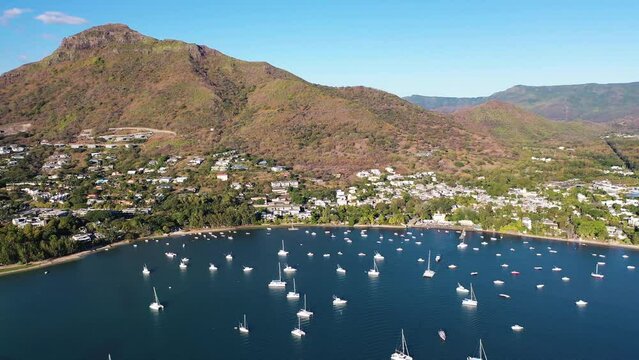 Aerial view of sailing boats on the harbour at sunset in Flic en Flac, Black River, Mauritius.