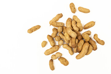 Unpeeled peanuts isolated on white.