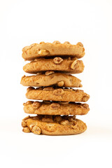Peanut cookies in a bunch on a white background.