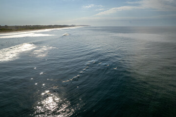Beautiful aerial view of people surfing in Hermosa Beach - Costa Rica