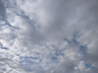 Light coming and illuminating the cloudy and dark sky