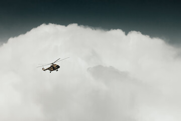 Fototapeta na wymiar Helicopter in front of cloud from Blackhorse camp, Kabul