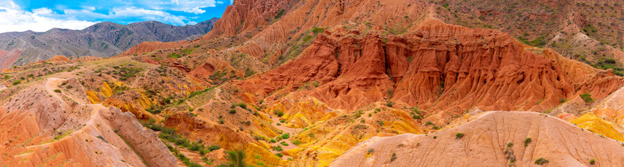 Fototapeta na wymiar Natural unusual landscape red canyon of extraordinary beauty is similar to the Martian landscape. Multi-colored canyon fairy tale in Kyrgyzstan. Charyn Canyon. Amazing beautiful landscape.
