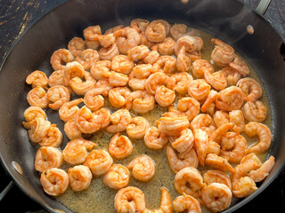 Spicy Sauteed Shrimp in a Large Skillet: Peeled and deveined shrimp cooked in a nonstick saute pan