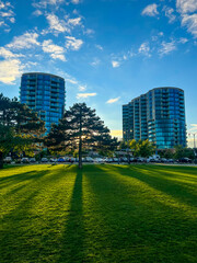 Luxury waterfront condominiums on a bright sunny day in autumn with sun setting behind