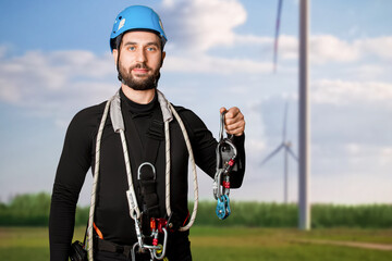 A man in a belay system for work at height. Carabiners, straps, safety ropes. Industrial...