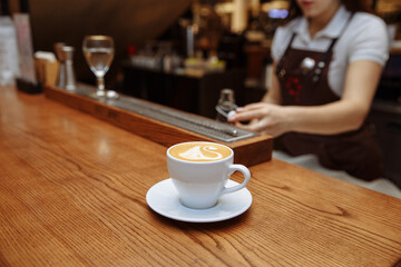 Making coffee in a coffee shop on a coffee machine