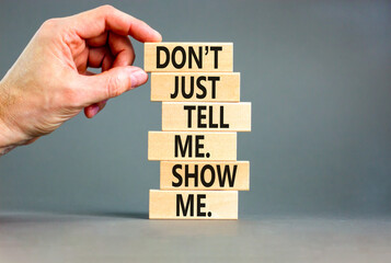 Tell or show symbol. Concept words Do not just tell me, show me on wooden blocks. Beautiful grey...