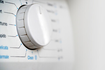 Button of a washing machine with modes closeup.
