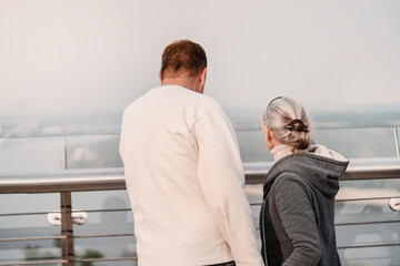 A man and a woman walk and spend time together.