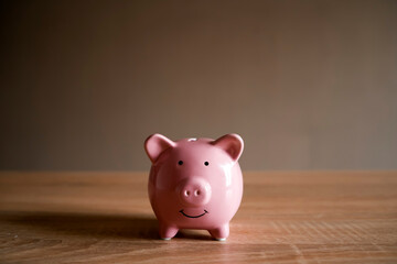 Cute piggy bank on the table.