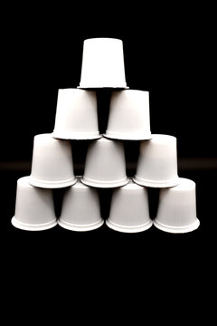 Coffee k-cups stacked in a pyramid shape.