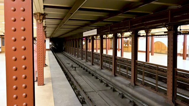 Budapest, Hungary, August 2022. Footage at the m1 metro station, the historic first line of the city. You see the light emerge from the tunnel: the subway arrives.