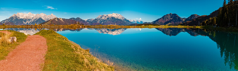 High resolution stitched autumn panorama with reflections in a lake at the famous Streuboeden summit, Fieberbrunn, Tyrol, Austria