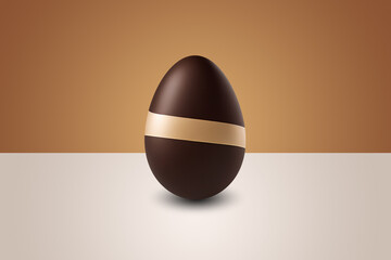 Milk and white chocolate Easter Egg in front of a brown wall and on a white floor 