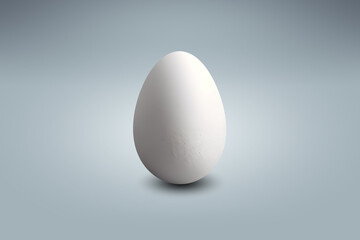 White egg on a light blue floor