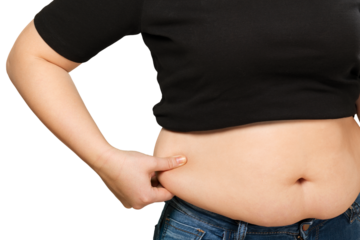Women in jeans hand holding excessive belly fat