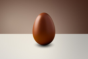 brown chocolate Easter egg in front of a brown wall and on a white floor
