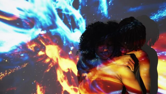 Sensual love. Beloved couple. Tranquil people. Tender black man hugging and kissing woman posing on double exposure golden blue space lights flow overlay background copy space.