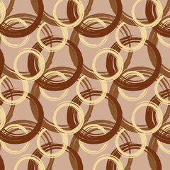 A brown and gold pattern with circles and stripes.