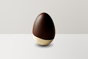 black and white chocolate Easter Egg in front of a white wall and on a white floor