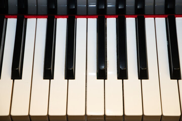 Naklejka premium Piano keys. Photo taken from above and you can see the black and white keys.