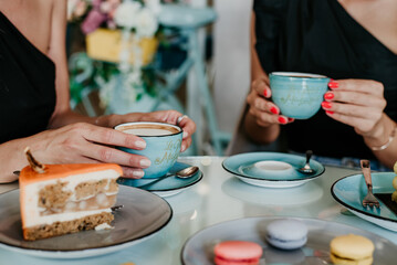 woman details hands drinking coffee eating cakes and macaroons popsi nails inspo aesthetic
