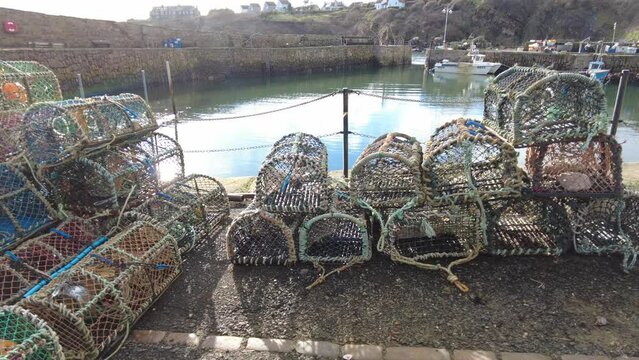 Lobster baskets at Crail harbour, a historic fishing village on the east coast of Scotland in the East Neuk of Fife.