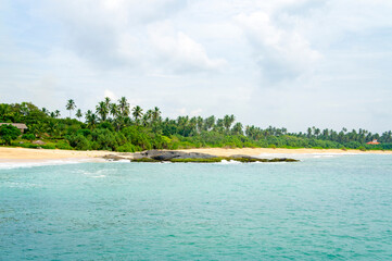 Beautiful tropical landscape. Sandy ocean shore. Beautiful texture background for tourism, design and advertising