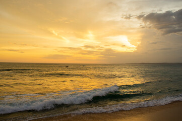Beautiful tropical sunset on the sandy coast
