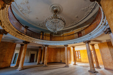Entrance round hall with chandelier at the abandoned palace