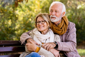 Portrait of a beautiful senior couple in the public park. Early retirement