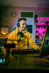 Young man male gamer playing computer game streaming video online © Miljan Živković