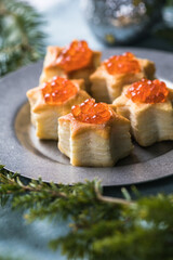 Christmas tree canape or sandwich with cucumber slice, salmon for festive x-mas snack. New year recipe