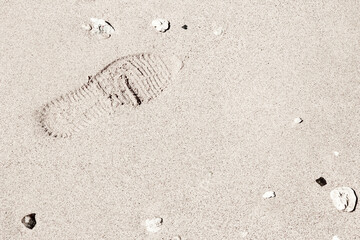 Beautiful footprints in the sand sea nature background