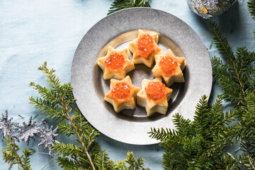 Christmas tree canape or sandwich with cucumber slice, salmon for festive x-mas snack. New year recipe