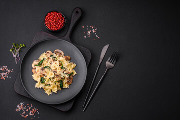Delicious farfalle pasta with mushrooms, cheese and spinach with spices
