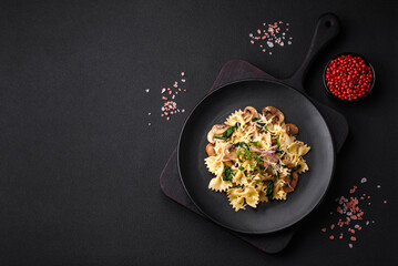 Delicious farfalle pasta with mushrooms, cheese and spinach with spices