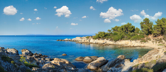 Aegean sea coast landscape with aquamarine water, view from Orange Beach (Chalkidiki, Greece).